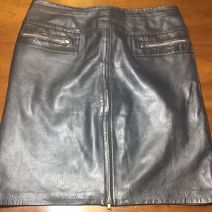 Cache’ leather skirt with silver zips at the front and slit